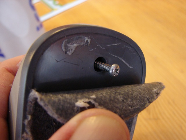 Unscrewing the bottom screw